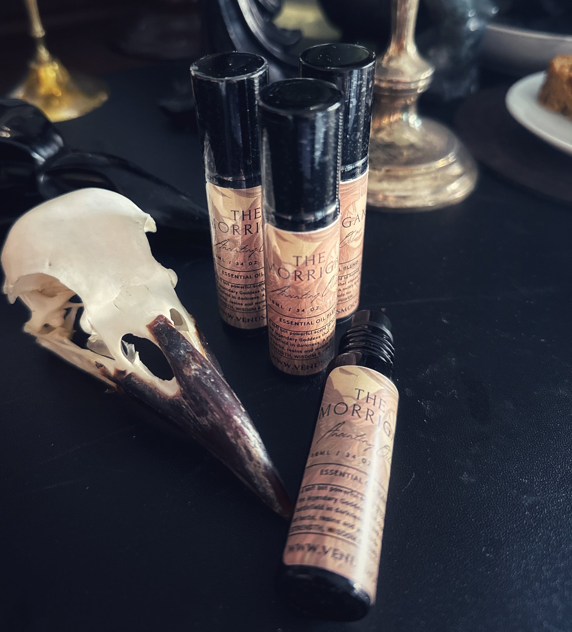 The Morrigan Anointing Oil in 10ml black glass roller bottle, a sultry ritual oil consecrated to the Celtic Goddess of Magick and Might.