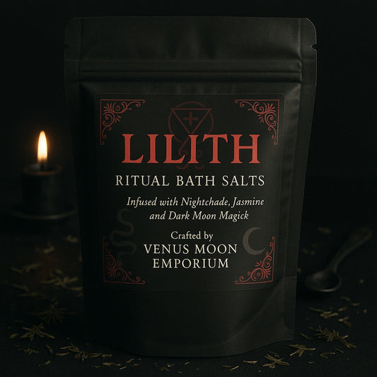 Matte black pouch of Lilith Ritual Bath Salts on a dark altar with herbs and candlelight. Gothic red lettering and esoteric sigils reflect her dark feminine power.