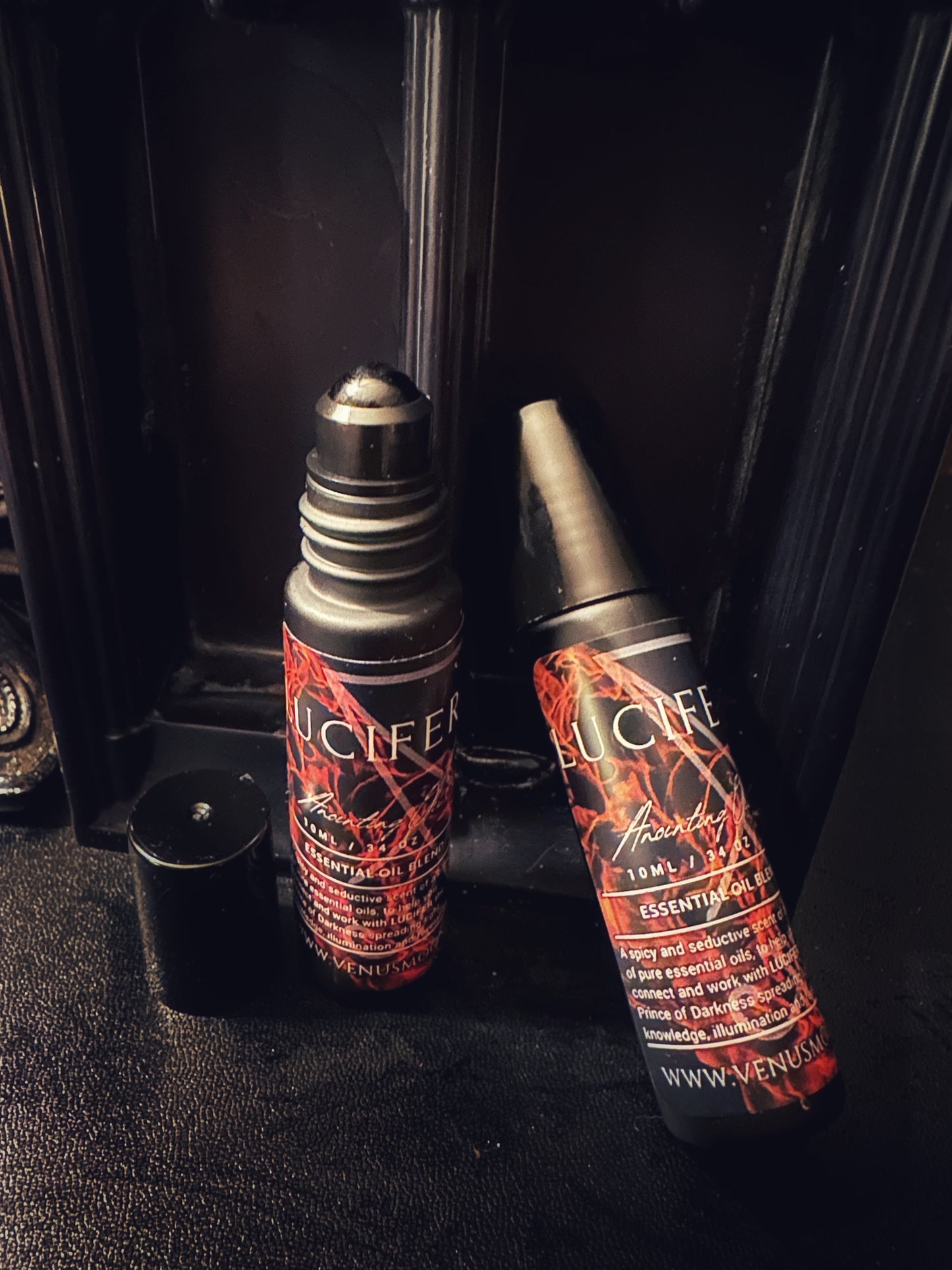 Lucifer Anointing Oil in 10ml glass roller bottle, a spicy and seductive ritual oil consecrated to the Lightbearer.