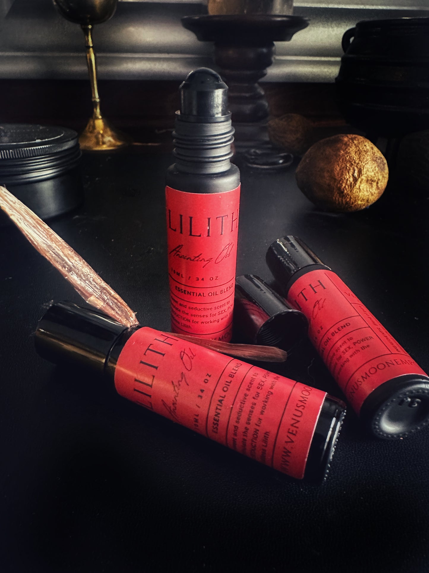 Lilith Anointing Oil in 10ml black glass roller bottle, a sweet and intoxicating ritual oil consecrated to the Goddess of Darkness and Light.