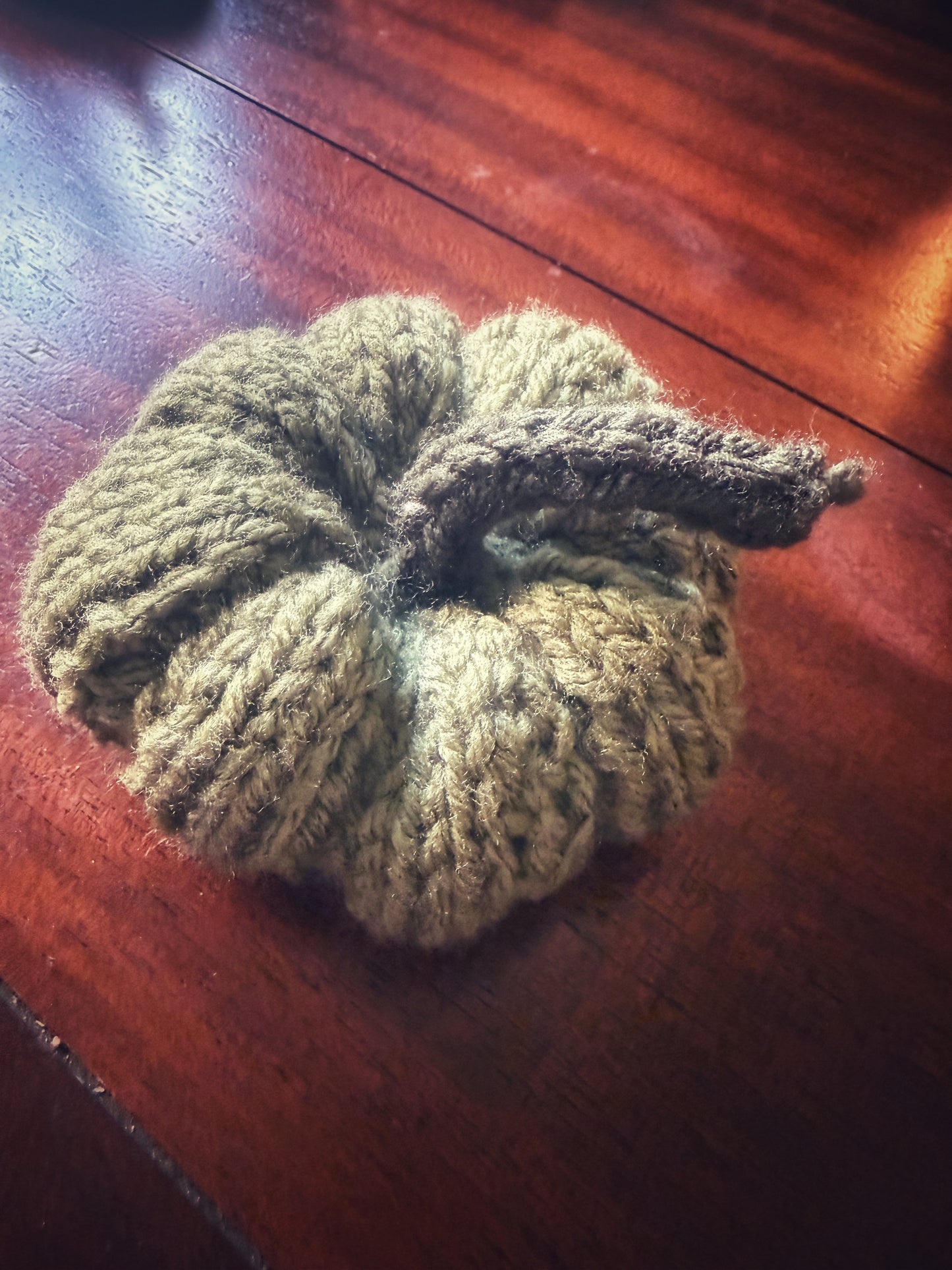 Handmade sage green knit pumpkin, autumn altar decoration.