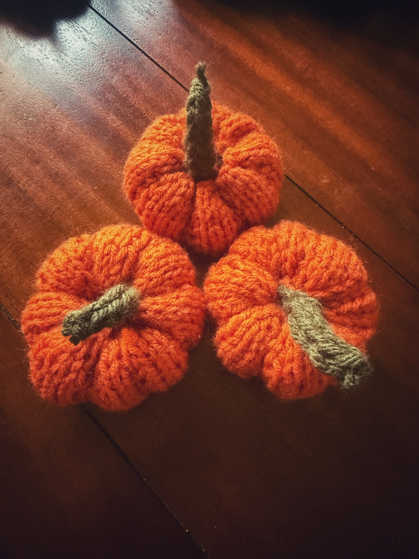 Orange knit pumpkins, handmade Halloween and Thanksgiving home décor.